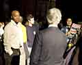 Grey-haired man and student protesters.